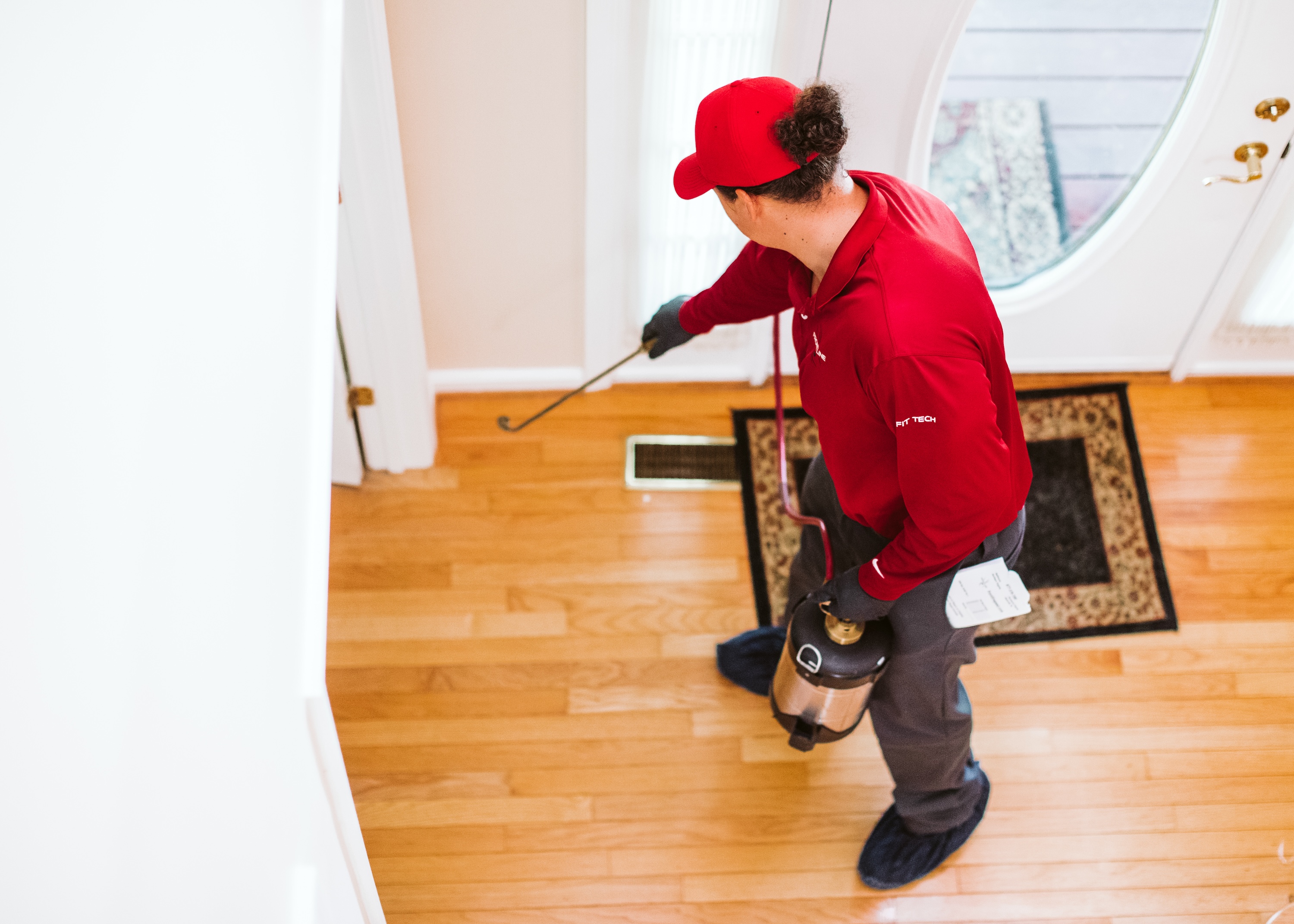 technician-spraying-home