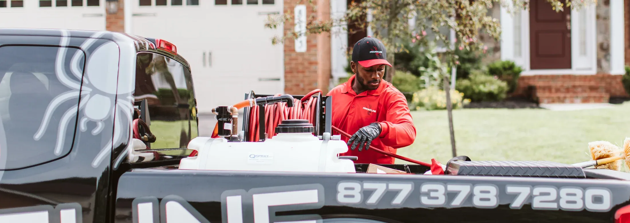 Technician standing next to truck