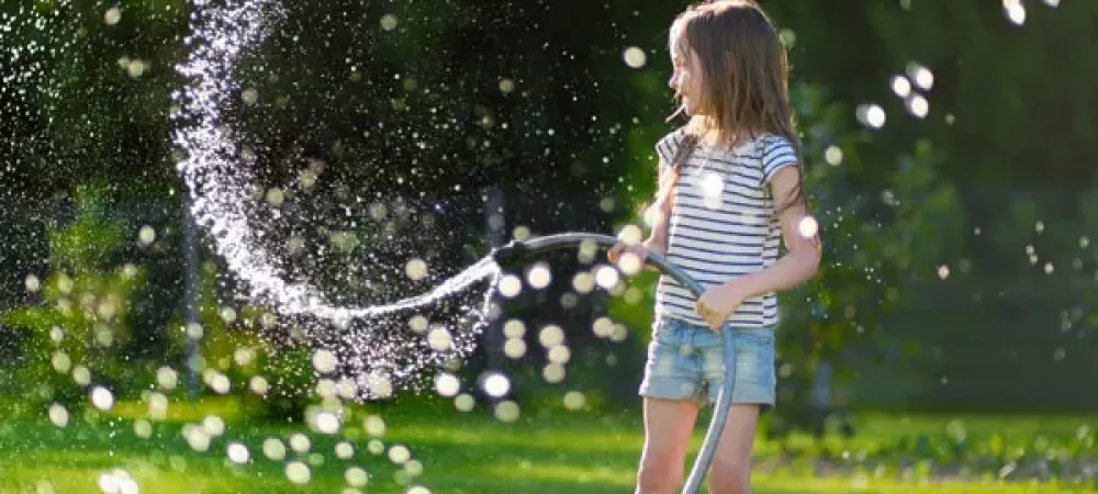 Girl playing in mosquito free yard