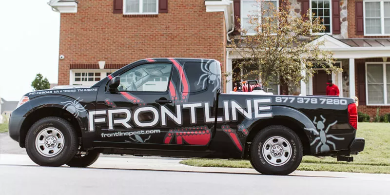 Frontline Pest truck outside home