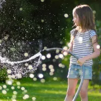 Girl playing in mosquito free yard
